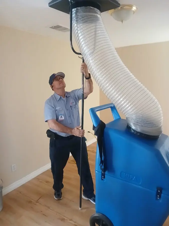 Furnace Tune-Up technician using HEPA equipment in Detroit